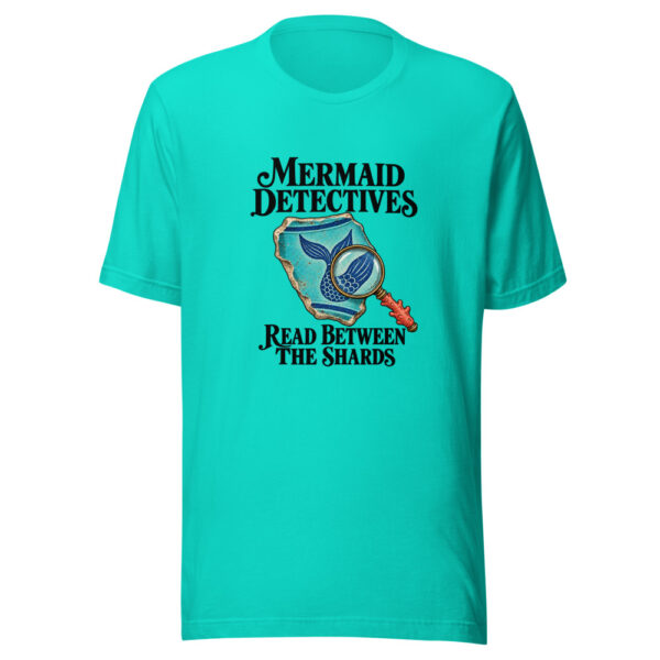 Mermaid Detectives Read Between The Shards Graphic Tee mockup 1 Mermaid Detectives Read Between The Shards Graphic Tee front view