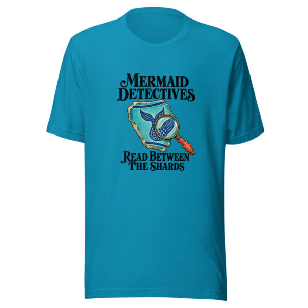 Mermaid Detectives Read Between The Shards Graphic Tee mockup 2 Mermaid Detectives Read Between The Shards Graphic Tee mockup 2