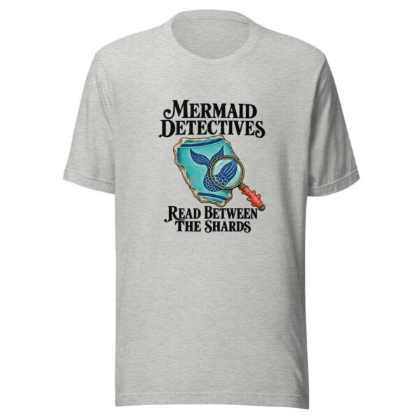 Mermaid Detectives Read Between The Shards Graphic Tee mockup 7 Mermaid Detectives Read Between The Shards Graphic Tee mockup 7